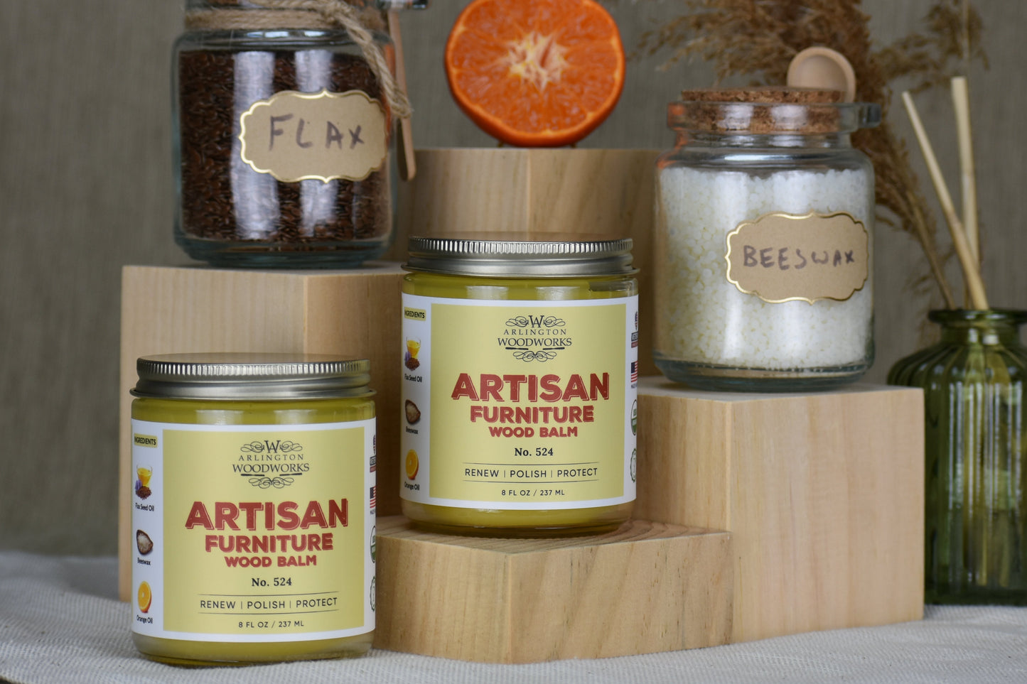Collection of Artisan Furniture Wood Balm jars with decorative elements on a neutral background